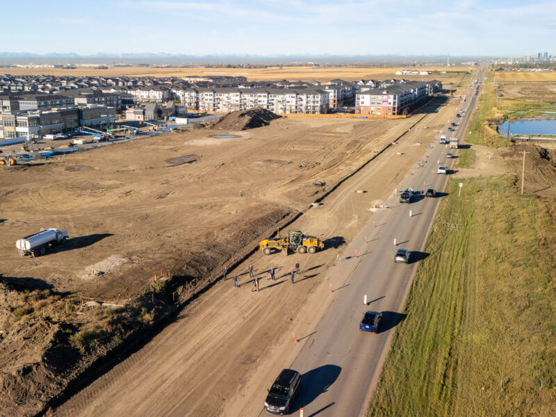 Aerial photo of Chestermere Blvd with the community of Chelsea in the background.